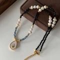 Tiger eye and pearl beaded necklace with water-drop shell pendant in gold finish - Avocado Shell Necklace XL0623