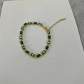 14K gold plated bracelet with green squares and evil eye charms on white background - Green