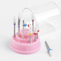 Macro view of ceramic nail drill bits set on a pink stand with protective cover - 48-Hole Small Box with Drill Bits / Pink
