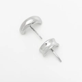 Macro detail of glossy silver crescent moon shaped metal earrings with stud backings - Earrings / Silver