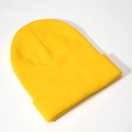 Detailed close-up of lemon yellow ribbed knit beanie with thick texture and wide cuffed brim - Light Yellow