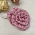 Chic pink floral hair claw clip with pleated texture displayed on a white ceramic plate - Pink Hollow Flower Hair Tie (Style 28)