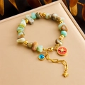 Bracciale di perline in pietre naturali colorate con malocchio e stelle su portagioie dorato - Stile Malocchio Stella (B1462)