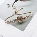 Detail of floral gold quartz watch with sparkling rhinestones and adjustable box chain - Rose Gold White