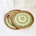 Detail of round handmade rattan trays with inlaid shell patterns in a two-piece set - Green Grape / 2-Piece Set