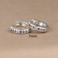 Macro view of 7mm silver hoop earrings featuring colorful cubic zirconia inlay stones - 7mm / Silver