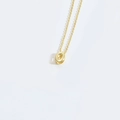 Minimalist golden clavicle necklace featuring a polished letter O alphabet pendant - Letter O