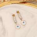 Detail of gold evil eye earrings with sparkling white rectangular cubic zirconia stones - Rectangle Zircon Row Stud Style (6#)