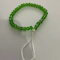 Green faceted beads and white polka dot bead phone strap with silver spacers on cord - Green Faceted Beads White Large Bead