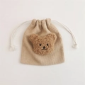 Detail of beige corduroy drawstring pouch with a cute brown plush bear decoration - Apricot (Coffee Bear)