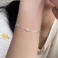 Delicate silver bracelet with three heart-shaped charms worn on the wrist - Silver Fine Chain Three Hearts (MY37352)