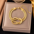 18K gold plated stainless steel double snake chain bracelet with a central knot design - Knotted Snake Chain (E77) Gold