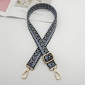 Detail of adjustable geometric woven strap with purple and green patterns and gold hooks - Light Blue Black Purple + Gold Hook