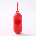 Portable red capsule-shaped dog waste bag dispenser with hook for pet leashes - Pill Dispenser / Red