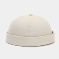 Detail of beige docker hat showing fabric texture and six-panel stitching design - Adjustable / Beige