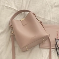 Sac seau rose en cuir PU avec poignée et bandoulière réglable sur tissu beige doux - Rose