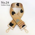 Detail view of adjustable wide nylon bag strap with heart patterns and gold lobster hooks - No. 24 + Gold Hook (Beige Brown with Black/Grey Heart)