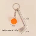 Balle de golf orange + club