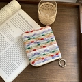 Colorful woven cotton mini coin purse with metal ring and zipper on a vintage wooden tray - Colorful Striped