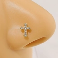 Golden cross nose ring with white zircon stones shown on a professional model - Gold Cross (4857)