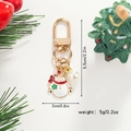 Detailed view of snowman keychain with pearl accent, length 5.5cm and width 2cm - Snowman