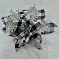 Macro view of black and white buffalo plaid Christmas flower with silver glitter details - Style A Black Plaid