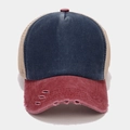 Detail of vintage trucker hat with navy denim crown and distressed red brim with mesh - Navy Blue and Wine Red