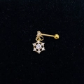 Close-up of golden snowflake stud earring with clear zircon inlay on textured surface - Gold-Snowflake