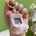 Pink mini arcade game keychain with gold ring, bell, and dog pattern design - Arcade - Pink