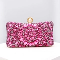 Macro detail of rose pink evening clutch with floral crystals and large pearl clasp - Rose Red