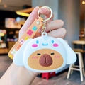 Cute white puppy and capybara plush keychain with orange floral silicone strap charm - Cinnamoroll Capy Purse