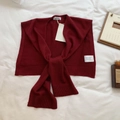 Women's burgundy wool blend knitted shawl with long ties shown on a white background - Angola Red