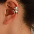 Gothic skull and crossbones ear cuff in vintage silver finish worn on the upper ear - Skull Ear Cuff (0424) / Antique Silver