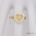Detail view of gold heart ring with Mary relief and clear crystals on a white hand model - Heart Virgin Mary Style (F)