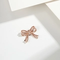 Rose gold bow pendant with pearls and rhinestones on minimalist white background - Pearl Rhinestone Bow (PJ0047) / Rose Gold
