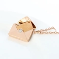 Detail of creative rose gold envelope pendant necklace with sliding metal letter insert - Rose Gold Plain