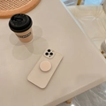 Beige iPhone case with integrated ring stand on a minimalist aesthetic desktop - 15 Pro Max / Tea White