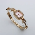 Detailed side view of a gold square quartz watch featuring a sparkling flower crystal bracelet - Rose Gold Case Pink Dial