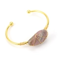 Handmade gold wire wrapped bracelet featuring a natural pink crystal stone centerpiece - Rhodonite