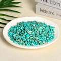 Natural bulk turquoise crushed stones with brown texture in a white ceramic dish - 100 Grams Of Artificial Turquoise (5-7mm)