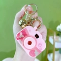 Pink camera-shaped whack-a-mole game keychain with strawberry print and gold bell - Projector Camera - Pink