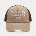 Detailed view of embroidery on breathable mesh trucker hat in khaki and brown colors - Khaki + Coffee Mesh