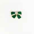 Close-up of a vintage dark green enamel bow brooch with gold-plated metal edges - 81*Green Bowtie Floral Pin