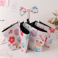 Manual folding umbrella with red-purple floral pattern and decorative bow handle - 3-Fold Manual Style - Flower Sea