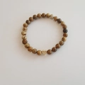 Vintage map stone beaded bracelet featuring a gold heart charm on white background - Picture Jasper Bracelet 6MM