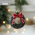Christmas wreath ornament with red berries and a festive bow for tree decoration - Green Wreath Style
