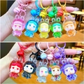Gros plan de porte-clés fille lapin colorés avec clochettes et fermoirs assortis - Style Fermoir Mousqueton / Style de fille lapin à perles lumineuses (Mélange aléatoire)