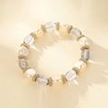 Elegant beaded bracelet with white pearls, grey crystals, and golden metal spacers - Pearl White Grey Crystal