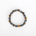 Elastic yoga bracelet featuring brown tiger eye beads and dark grey magnetic hematite stones - Twisted Tiger Eye Bracelet