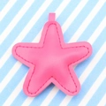 Pink handmade leather star keychain pendant with stitched edges on striped background - Rose Red